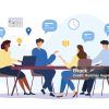Four coworkers sit around a table in a meeting, sharing ideas with speech bubbles and floating icons such as a calendar and lightbulb.
