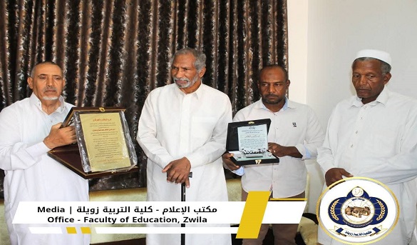 Four men in white shirts at an award ceremony; one holds a framed certificate, another a plaque, with curtain backdrop and a university emblem visible.